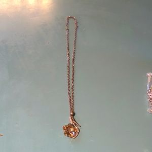 Silver shoe and flower necklace